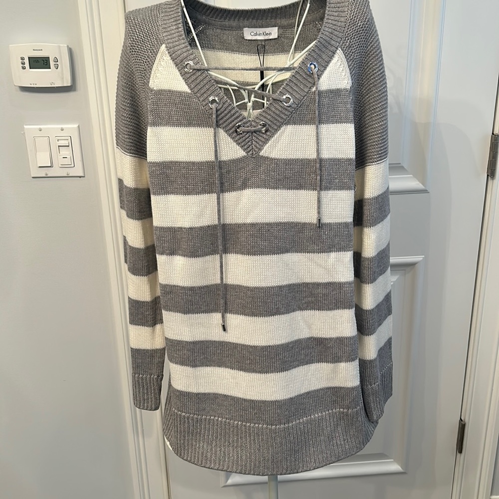 Women’s size large, new with tags Calvin Klein sweater
